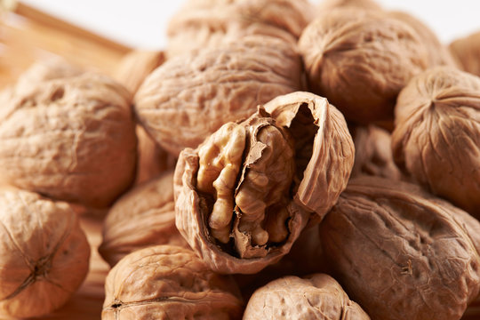Pile of walnuts on white background