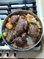  this photo shows cooking a pheasant with a young potato