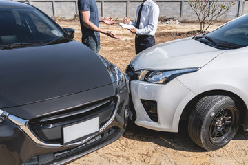 Insurance Agent and customer assessed negotiation, checking and signing on report claim form process after accident collision, Traffic Accident and insurance concept