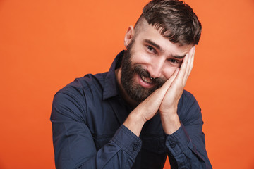 Image of joyful stylish man with nose jewelry smiling at camera