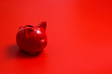 Red piggy Bank on a red background