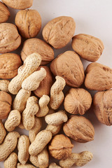 Heap of walnuts and peanuts background