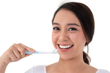 Beautiful Asian woman holding a toothbrush for brush teeth. Her is smile and teeth are white and...