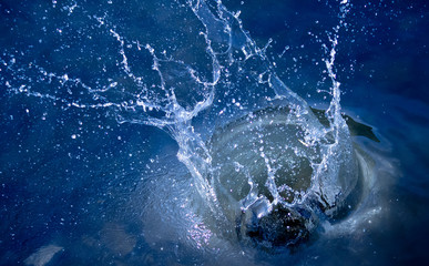 splash in blue water
