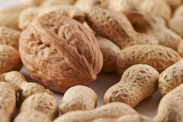 Heap of walnuts and peanuts background