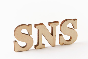   Word SNS wood blocks on white background 