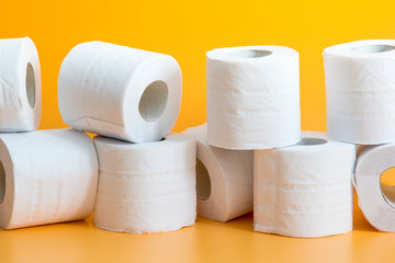 Lots of toilet paper rolls in a groupм