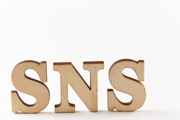   Word SNS wood blocks on white background 