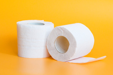 Lots of toilet paper rolls in a groupм