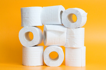 Lots of toilet paper rolls in a groupм