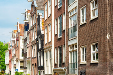 Fototapeta na wymiar Amsterdam, Netherlands - May 23, 2018 : Beautiful street view of Traditional old buildings in Amsterdam,Netherlands