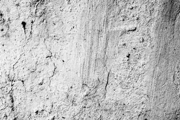 Texture of a concrete wall with cracks and scratches which can be used as a background