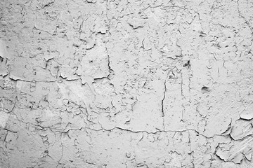 Texture of a concrete wall with cracks and scratches which can be used as a background