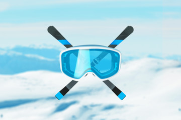 Blue snow goggles and skis crossed. Mountain peaks in background