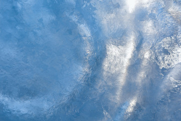 Ice background. The frozen texture of the water