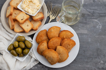 typical portuguese snack with meat rissois de carne on ceramic background