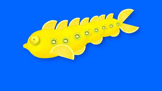 Looping animated video of a yellow fish made from lemon with kiwi inserts on a blue background with a brightness mask for cutting out the background during video editing.