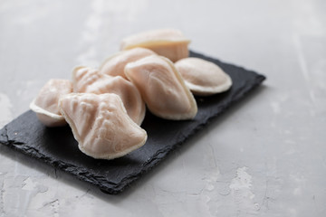 traditional portuguese sweets ovos moles on black ceramic board