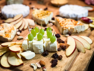 tasty mix cheese plates with fresh fruits & nuts