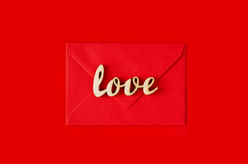 Greeting card for Valentine's Day. Red envelope with a love message. Valentine's day background.