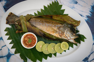 Thai style grill fish in banana leave