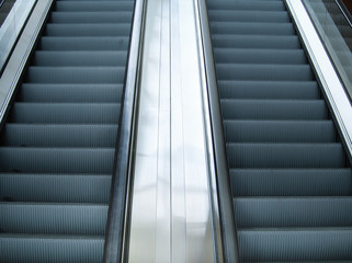 Empty escalator stairs in subway station or shopping mall, Modern escalators in an office building. 