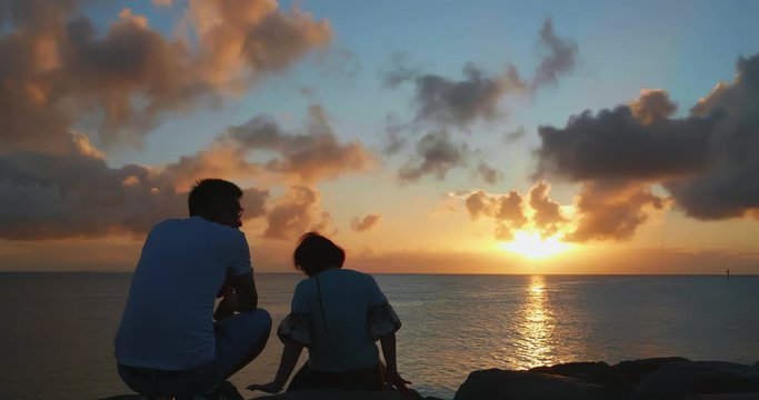people sit at the beach