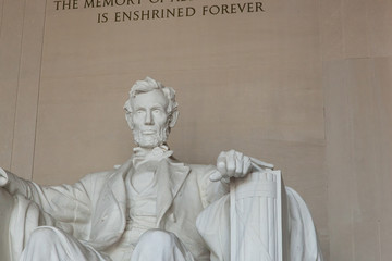 Washington DC - December 6, 2015:  A statue of Abraham Lincoln from inside the Lincoln Memorial - 313865017