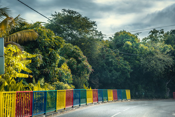 Colorful balustrade on the edge of a country road in Guadeloupe