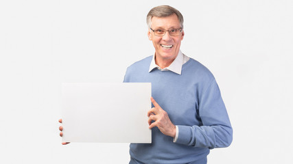 Smiling Senior Man Holding Blank Poster Standing, White Background, Panorama