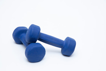 Blue dumbbells on a white background. The concept of sports.