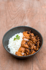 Rice and Fried Pork Belly Wooden table holder And with chili and garlic topping