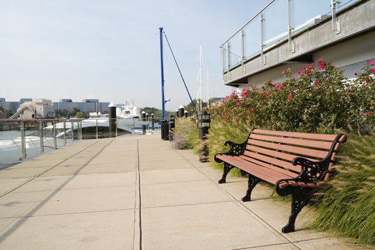 Bench for leisure time beside docking super yacht -- Stamford City Harbor View, Connecticut