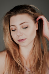 portrait of blonde girl with blue eyes and big bokeh