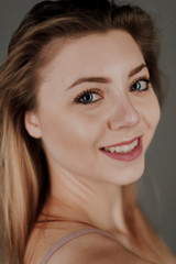 Obraz premium portrait of blonde girl with blue eyes and big bokeh