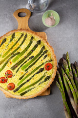 Pie with asparagus and tomatoes, food top view