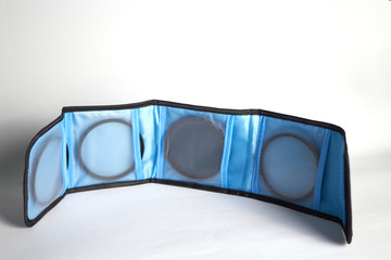 lens filter holder in bag include ND filter,Macro filter,star filter on white background