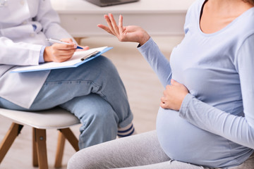 Unrecognizable Pregnant Woman Talking With Therapist In Office, Cropped