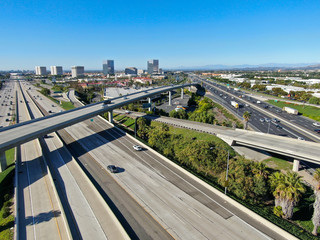 Aerial view of highway transportation with small traffic, highway interchange and junction, San Diego Freeway and Santa Ana Freeway. USU California