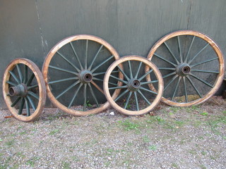 4 wheels in front of a wall