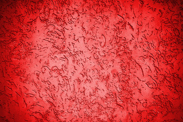 Red Concrete wall with a lot of small dips. Background texture for design.