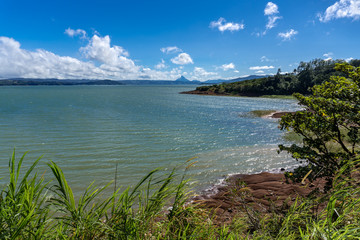 Costa Rica. Lake Arenal (Spanish: Lago Arenal). The largest lake in Costa Rica was tripled in size by the construction of the Arenal dam.