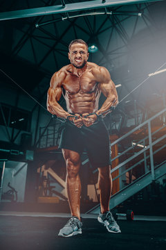 Bodybuilder in the Gzm, Performing Cable Chest Exercise