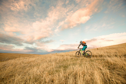 One woman enjoys the first rideable window over Jones Pass on the Continental Divide Trail in Colorado. As the snow melts off the high alpine trails, rocky singletrack is revealed on the Rocky Mountains for a short window before winter hides them under her blanket again.