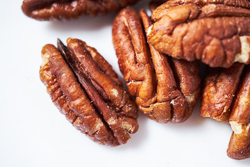 pecans on a white background