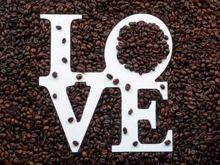 Top view of roasted coffee beans with love. Coffee lovers