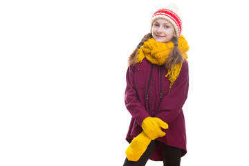 Winter Kids Concepts. Portrait of tranquil Positive Caucasian Girl Posing in Winter Outfit Against White in Studio.