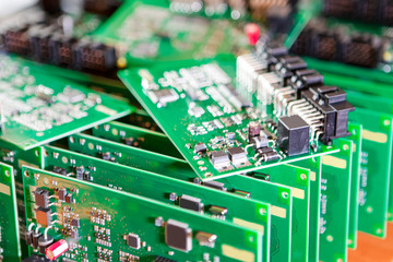 Automotive Printed Circuit Boards with Surface Mounted Components with PCBs On Top of Boards.