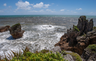 Fototapeta na wymiar Paparoa National Park. Punakaiki. Pancake Rocks. Coast. Rocks. Waves