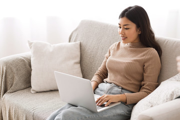 Find job online. Girl searching for work opportunities on laptop